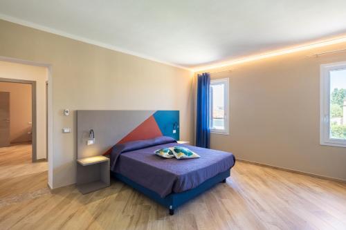 Ένα ή περισσότερα κρεβάτια σε δωμάτιο στο I 2 Pini Room&Breakfast
