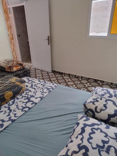 Postel nebo postele na pokoji v ubytování Tamraght samba