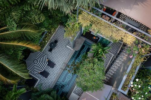 an overhead view of a patio with chairs and plants at Shinta Mani Angkor in Siem Reap