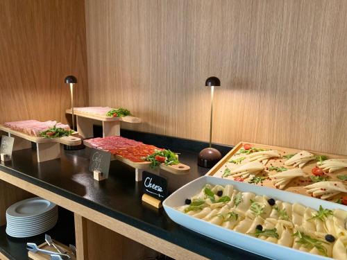 a buffet with different types of food on a table at Onix Fira in Barcelona