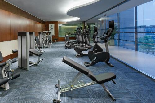 a gym with cardio equipment in a building at Four Points by Sheraton Suzhou in Suzhou