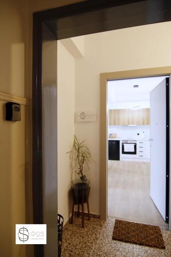 a hallway with a door leading to a kitchen at FOS Kastoria in Kastoria