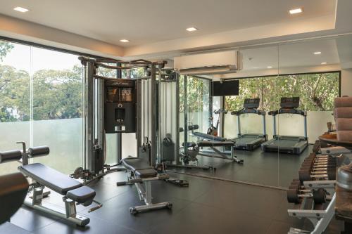 a gym with a row of treadmills and machines at Shinta Mani Angkor in Siem Reap