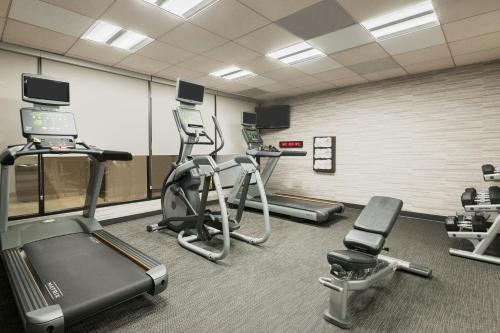 a gym with several exercise bikes and treadmills at Courtyard Sarasota Bradenton Airport in Sarasota