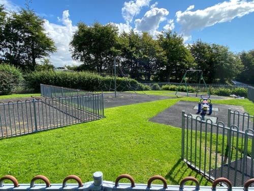 a park with a playground with a swing at No 10, Ayr, 130m2, New Decor December 2024, All new entire 3 bedroom garden house in Ayr