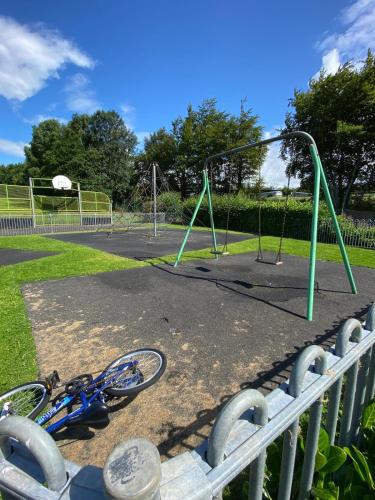 a bike parked next to a playground at No 6, Ayr, 140m2, New Decor 2024, 3bedroom, detached house, with private gardens in Ayr