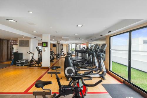 a gym with treadmills and elliptical machines at Sheraton Quito in Quito