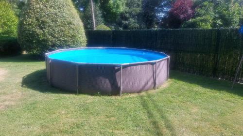 a swimming pool in a yard with a fence at Gaztañeta Baserria in Olaeta