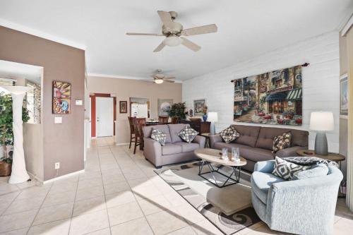 a living room with a couch and a table at 2BR 2BA Charming Cathedral City Condo with Territorial Views in Cathedral City