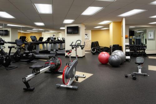 a gym with a lot of exercise equipment on the floor at Tampa Airport Marriott in Tampa