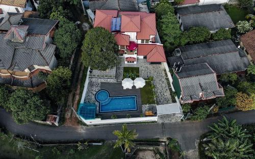 an aerial view of a house with a swimming pool at Travel Cage in Hikkaduwa
