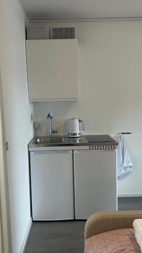 Кухня или мини-кухня в Ilulissat City Apartments - Apartment 1
