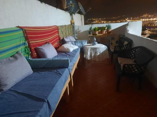a living room with a couch and a table with a table at The Medina Riad in Tangier