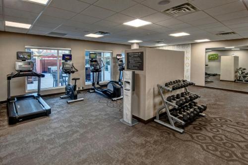a gym with treadmills and machines in a room at Residence Inn by Marriott Tulsa Midtown in Tulsa