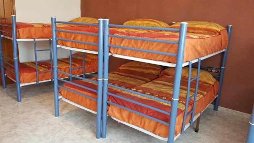 a couple of bunk beds in a room at Albergue Ciudad del Doncel in Sigüenza