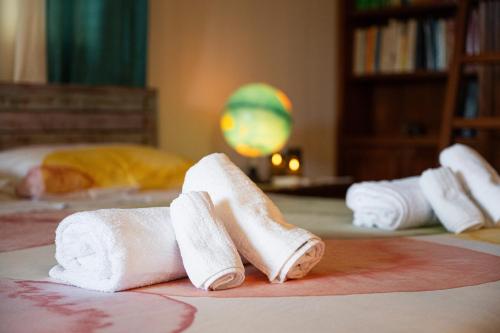 a group of rolled up towels on a table at Villa Pilato in Poggio Dei Pini