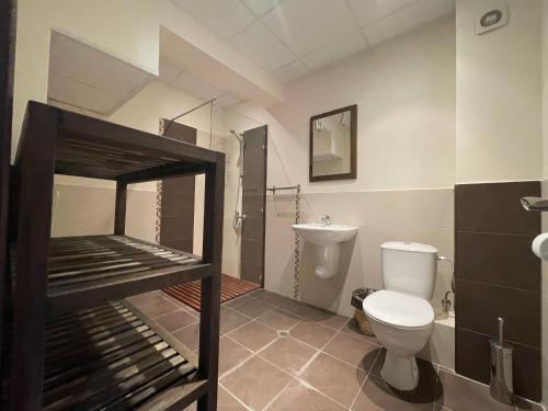 a bathroom with a bunk bed with a toilet at GeshaHillPark villas 32 in Gesha