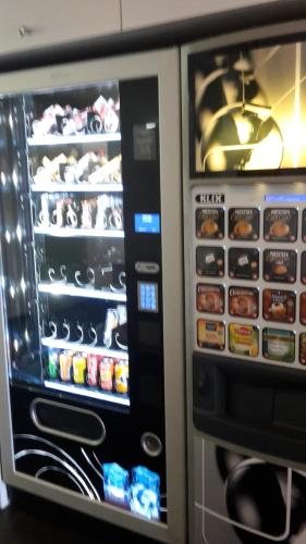 a vending machine with food inside of it at ibis budget Orly Rungis in Rungis