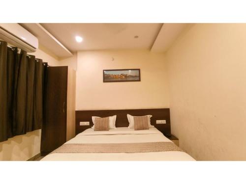 a bedroom with two beds in a room at Hotel Udaipur Stay at Prime Location in Udaipur