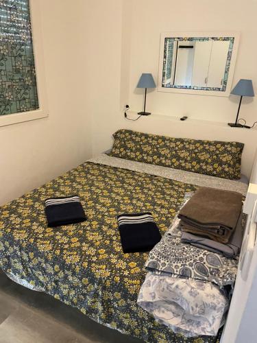 a bedroom with a bed with two pillows on it at Vinamar Alena in La Mata
