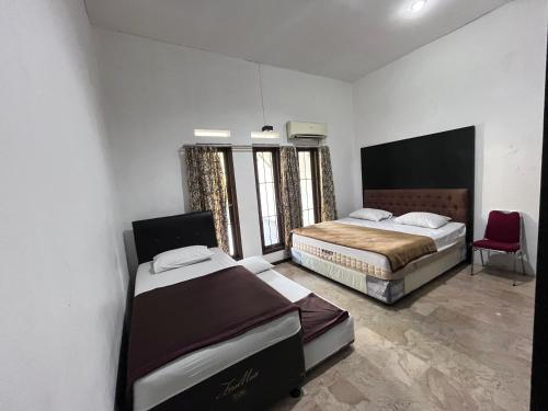 Postel nebo postele na pokoji v ubytování Hotel O Bungalow Homestay