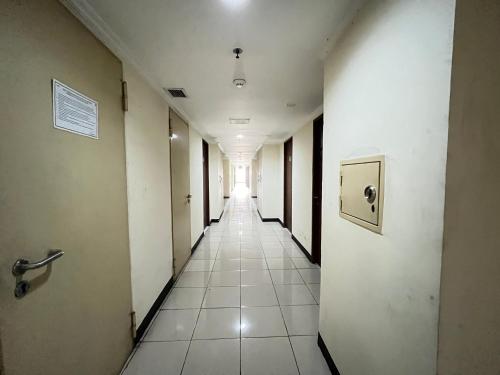 an empty hallway in an office building at OYO 94709 Margonda Residence Tower D in Depok