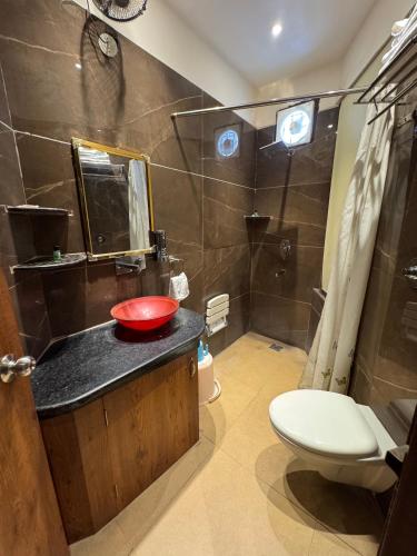 a bathroom with a sink and a toilet and a shower at Sky Star Hotel in Amritsar