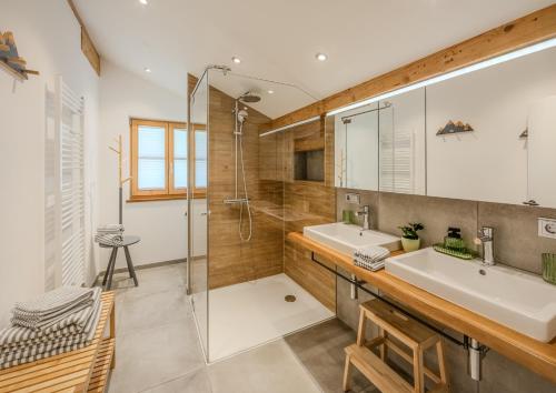 a bathroom with a sink and a shower at Alpin Chalet Kern in Klösterle am Arlberg