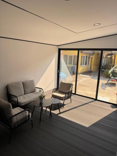 a living room with a couch and chairs and a table at Centar in Krapina