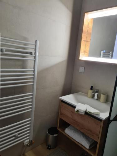 a bathroom with a sink and a mirror at Alex in Bjelašnica