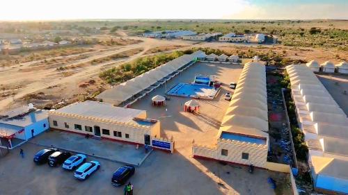 an aerial view of a parking lot with buildings at Melody Moon Desert Camp & Resort in Jaisalmer