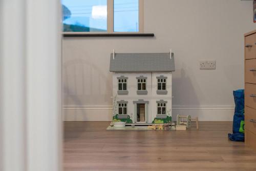 a model of a house in a room at Willow Valley in Monaghan