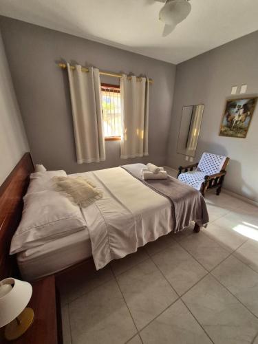 En eller flere senge i et værelse på CASA 97 completa! Horário Flexível!