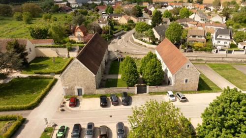 an aerial view of a church with cars parked in a parking lot at Auberge du Chateau Bleu in Tremblay En France