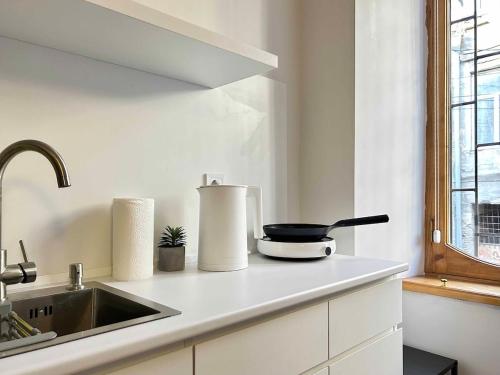 a kitchen with a sink and a counter top at Dream in Tbilisi City