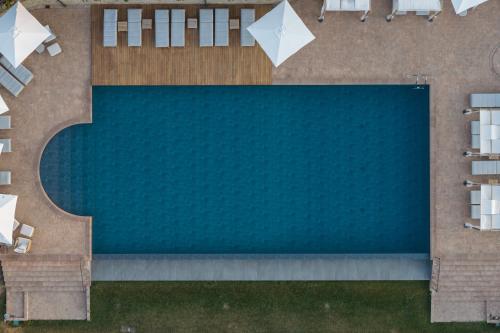 an overhead view of a swimming pool in a backyard at Borgo Dei Conti Resort Relais & Chateaux in Monte Petriolo
