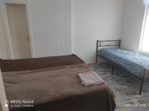 a bedroom with a bed and a bench in a room at Appartement mit Garten zentrumnah in Schwerin
