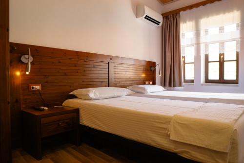 Postel nebo postele na pokoji v ubytování Hotel Kodra