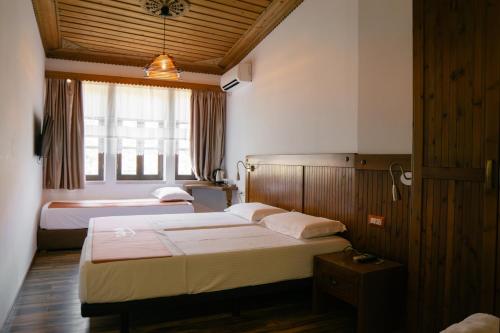 Postel nebo postele na pokoji v ubytování Hotel Kodra