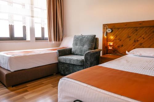 Postel nebo postele na pokoji v ubytování Hotel Kodra