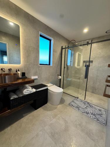 a bathroom with a sink toilet and a shower at Lake Hood Escape & Private Jetty in Ashburton