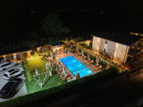 an aerial view of a house with a swimming pool at Villa Guesthouse Albion in Lezhë
