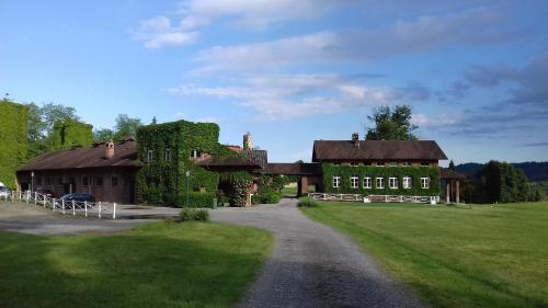 a large house with ivy on the side of a road at Tenuta Castello in Cerrione