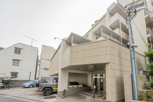 a building with a van parked in front of it at Near Shibuya Station 4Beds 5Max A175 in Tokyo