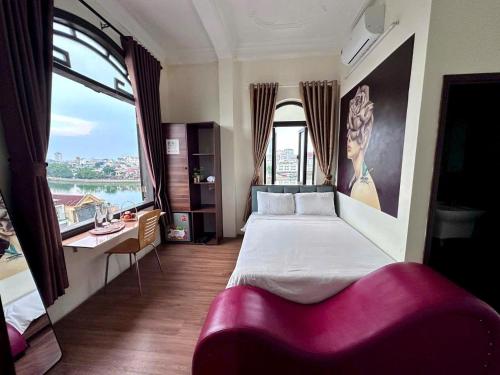 Postel nebo postele na pokoji v ubytování Queen's Motel