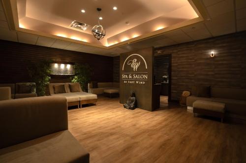 a salon with couches and a sign in a room at The Inn and Spa at East Wind in Wading River