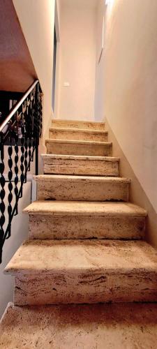 a set of stairs in a building at La Gatta in Montemerano
