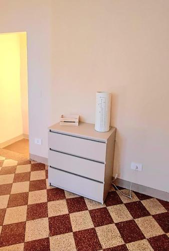 a dresser with a box on top of it in a room at La Gatta in Montemerano