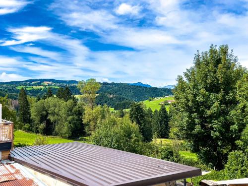 a view from the roof of a house with trees at Terrazzo Panoramico - Vicino ad Asiago in Roana