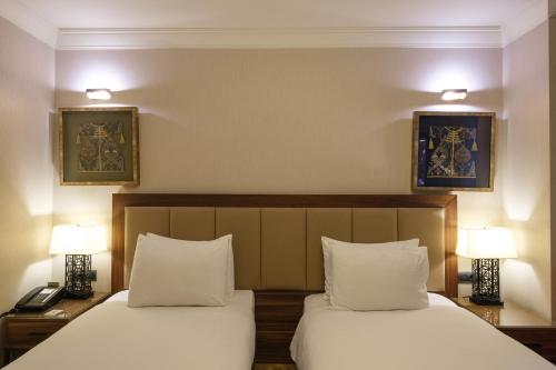 Ένα ή περισσότερα κρεβάτια σε δωμάτιο στο Golden Age Hotel Taksim